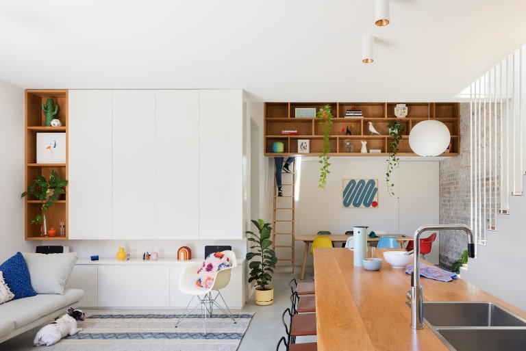 what-was-once-a-poorly-planned-floor-plan-has-transformed-into-open-brightly-lit-living-spaces-at-the-hub-of-the-home